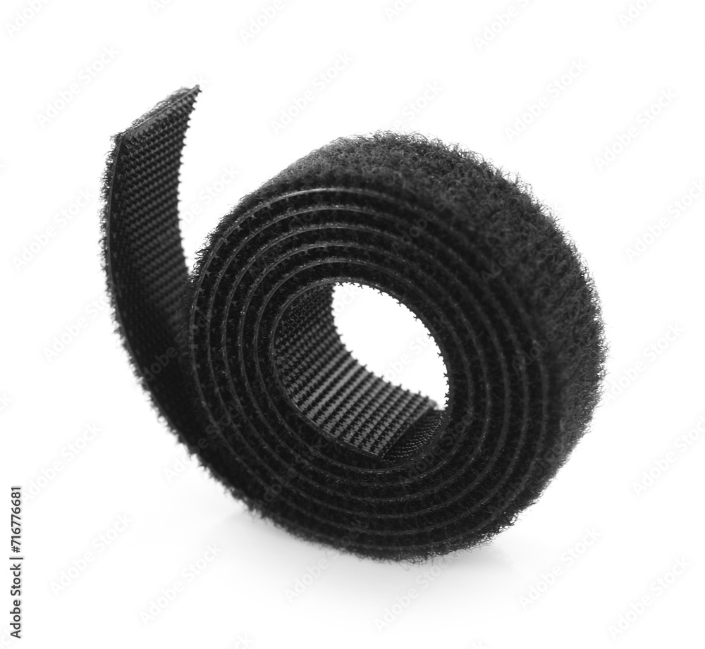 Velcro tape in a roll closeup on a white background. Velcro tape in a roll closeup on a white background.