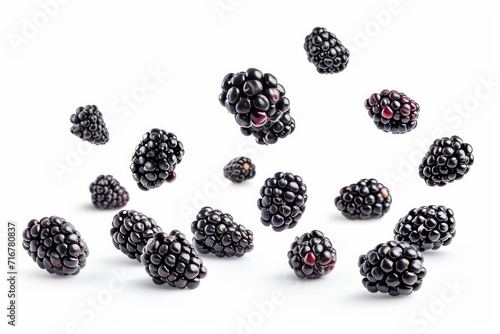 Falling blackberry fruits isolated on white background with clipping path