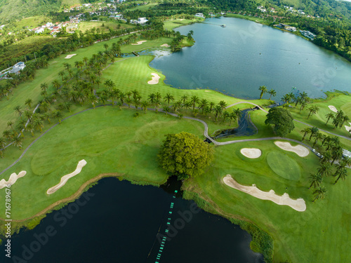 Aerial view of beautiful green golf field fairway and putting green Top view image for sport background and travel nature background  Amazing green nature view