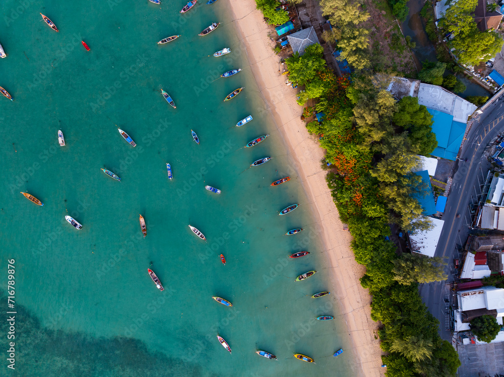 Aerial drone bird's eye view photo Top down of tropical sea with long tail fishing boats Travel boats at phuket thailand, Amazing top view sea nature landscape
