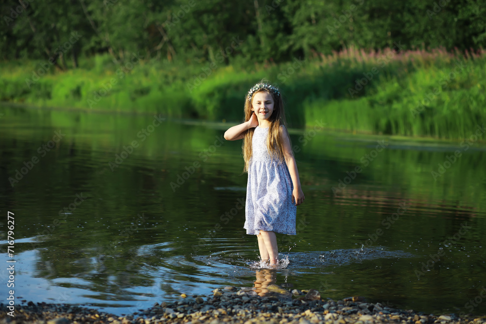 Children walk in the summer in nature. Child on a sunny spring morning in the park. Traveling with children. Children walk in the summer in nature. Child on a sunny spring morning in the park. Traveling with children.