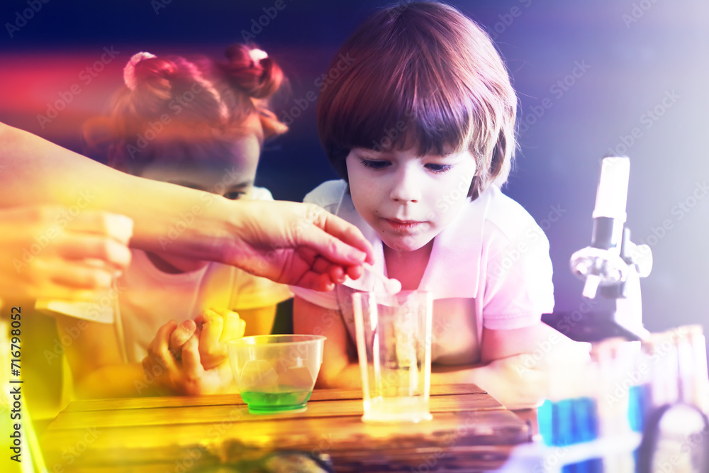 Background with highlights of children of scientists. A boy and a girl are experimenting in the laboratory. Background with highlights of children of scientists. A boy and a girl are experimenting in the laboratory.