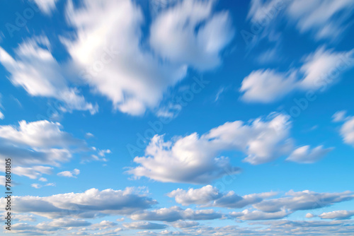 Moving clouds in a blue sky background
