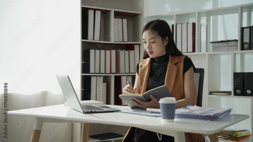 Asian businesswoman doing accounting about project plans and financial results in the office Marketing strategy analysis stock trading financial advisor 4k Asian businesswoman doing accounting about project plans and financial results in the office Marketing strategy analysis stock trading financial advisor 4k