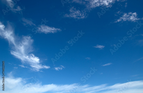 White fluffy clouds in the blue sky.