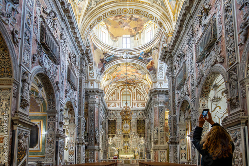 Palermo, Sicily, Italy, A tourist inside the ornate interior of the Chiesa di Santa Caterina d'Alessandria, Saint.Catherine of Alexandria Church. photo