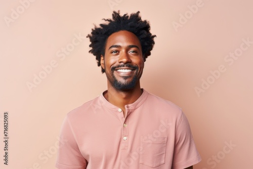 Portrait of a glad afro-american man in his 30s donning a trendy cropped top against a pastel or soft colors background. AI Generation