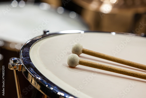  Drumsticks lie on timpani close-up