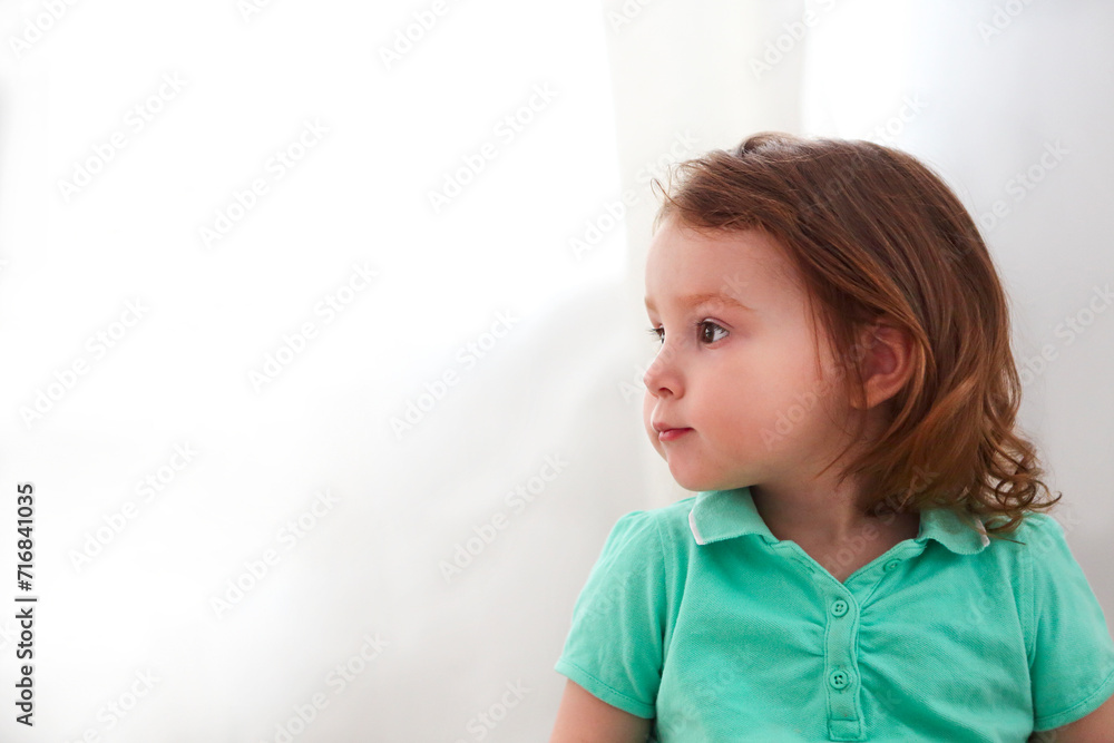 Close up of child profile with red hair