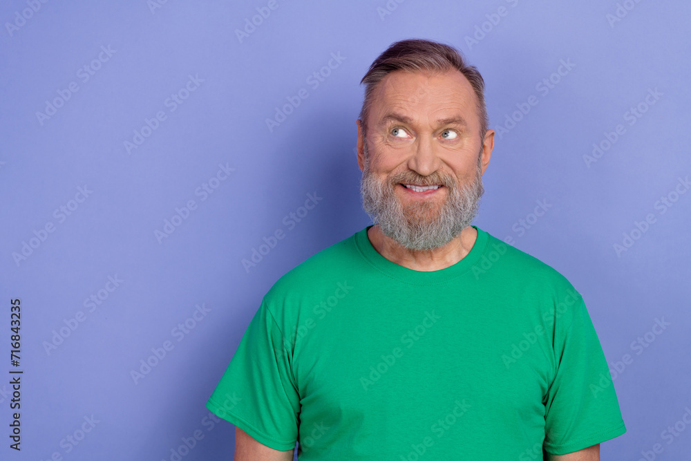 Portrait of minded creative person beaming smile look interested empty space isolated on purple color background Portrait of minded creative person beaming smile look interested empty space isolated on purple color background