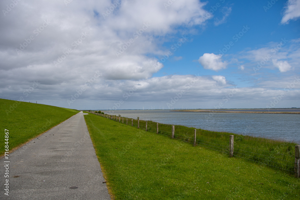 Hiking trail past the dike on the German Nordstrand peninsula