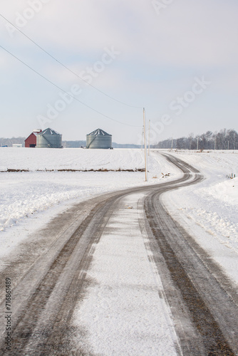Rural illinois farmland and farm buildings in the snow.  Illinois, USA.