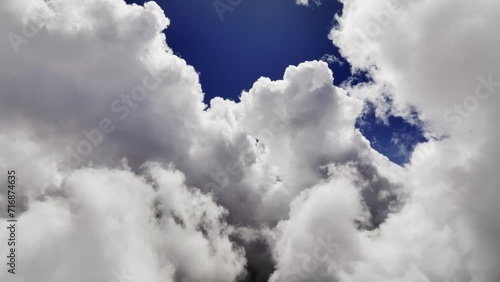 Flying through the clouds with a first-person view. Time lapse aerial view of weather changes high above the ground. weather background photo