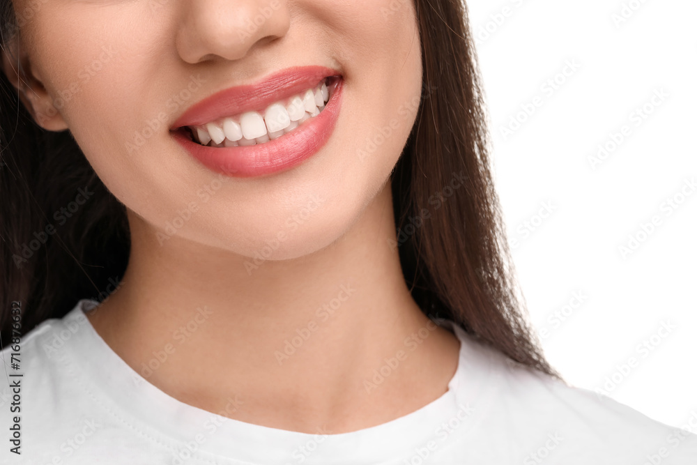 Woman with clean teeth smiling on white background, closeup Woman with clean teeth smiling on white background, closeup