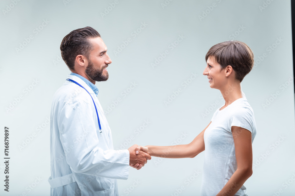Empathetic doctor, grateful patient, successful treatment comple Empathetic doctor, grateful patient, successful treatment comple
