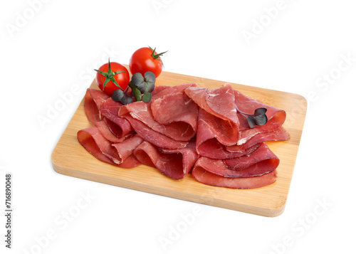 Slices of tasty bresaola and tomatoes isolated on white