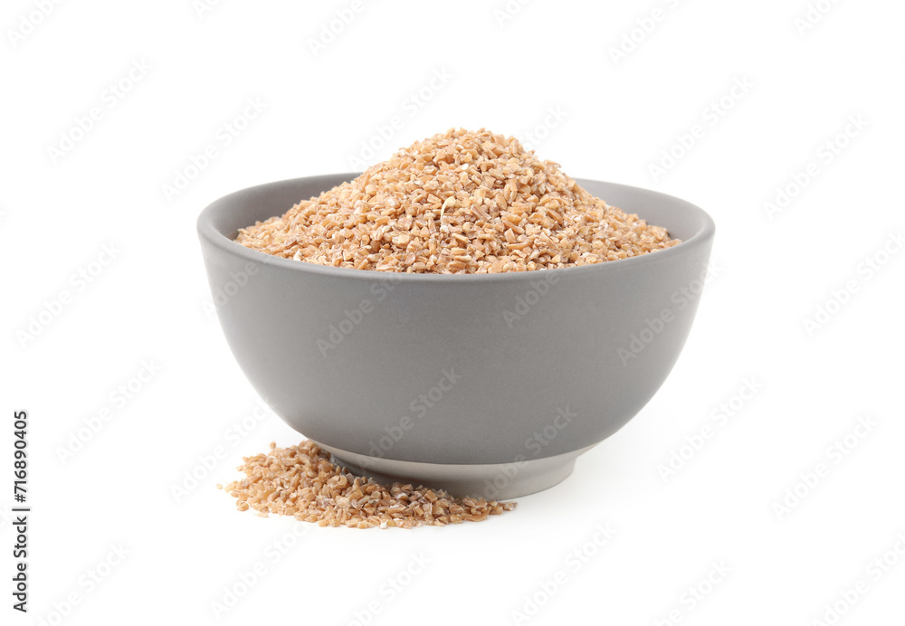 Dry wheat groats in bowl isolated on white Dry wheat groats in bowl isolated on white