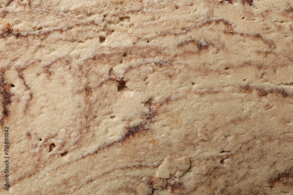 Tasty chocolate halva as background, closeup view Tasty chocolate halva as background, closeup view