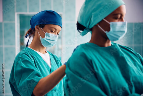 Female surgeons greeting ready for operating room.