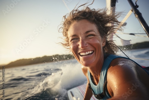 Portrait of a relaxed mature woman windsurfing in the sea. With generative AI technology © Markus Schröder