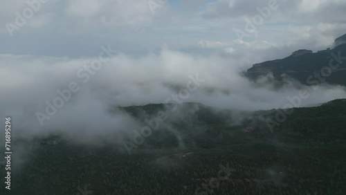 Mountain Serenity: Montserrat's Peaks Towering Above the Clouds, Aerial View