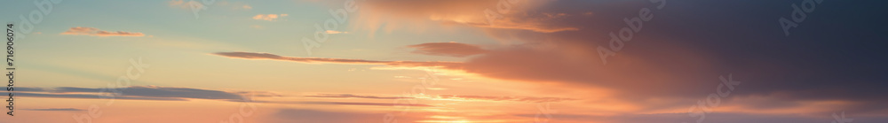 Vibrant extra wide panoramic sky. Fantasy banner sky. Rich colors. Daytime sunset beauty. Fiery glowing heavenly sky with gradient colors. Red, pink, orange, blue, yellow. Warm pastel sky colors. 