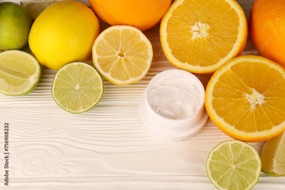 Cream with citrus extracts. Selective focus. Spa day, concept of freshness cream can with lemon lime and orange extract Cream with citrus extracts. Selective focus. Spa day, concept of freshness cream can with lemon lime and orange extract