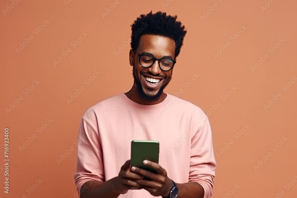 Portrait of toothy beaming nice African American man wear stylish t-shirt in eyewear hold smartphone arm in pocket isolated on color background Portrait of toothy beaming nice African American man wear stylish t-shirt in eyewear hold smartphone arm in pocket isolated on color background