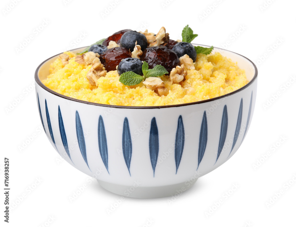 Tasty cornmeal with blueberries, dates, walnuts and mint in bowl isolated on white Tasty cornmeal with blueberries, dates, walnuts and mint in bowl isolated on white