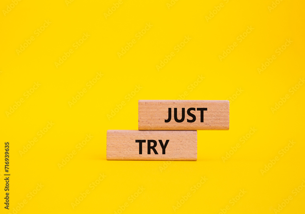 Just try symbol. Concept words Just try on wooden blocks. Beautiful yellow background. Business and Just Try concept. Copy space. Just try symbol. Concept words Just try on wooden blocks. Beautiful yellow background. Business and Just Try concept. Copy space.