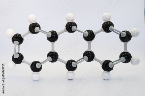 Anthracene molecule made by molecular model on white background. Chemical formula with colored atoms and bonds	 photo