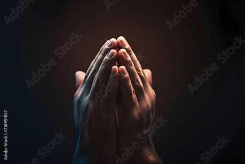 Praying hands with faith in religion and belief in God on dark background. Power of hope or love and devotion. Namaste or Namaskar hands gesture. Prayer position.