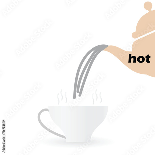 Teapot pouring hot water in a cup