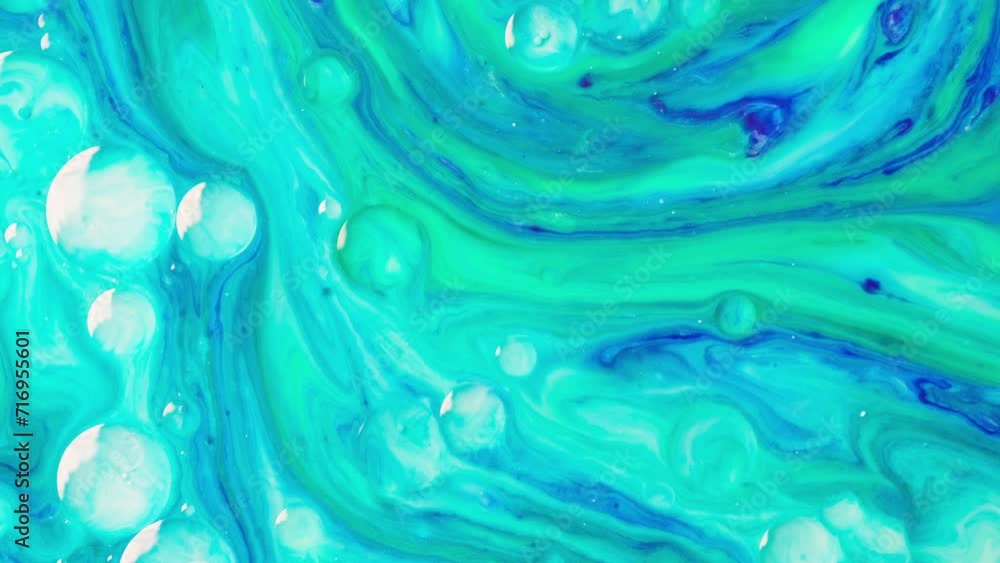 Background video abstract movement of green and blue liquid flow. Mixing colorful liquids slow motion video. High quality 4k footage Background video abstract movement of green and blue liquid flow. Mixing colorful liquids slow motion video. High quality 4k footage