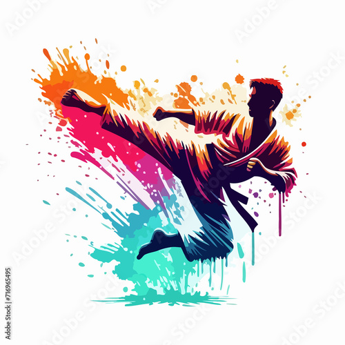 silhouette of karate man jumping with a kick with paint splashes photo