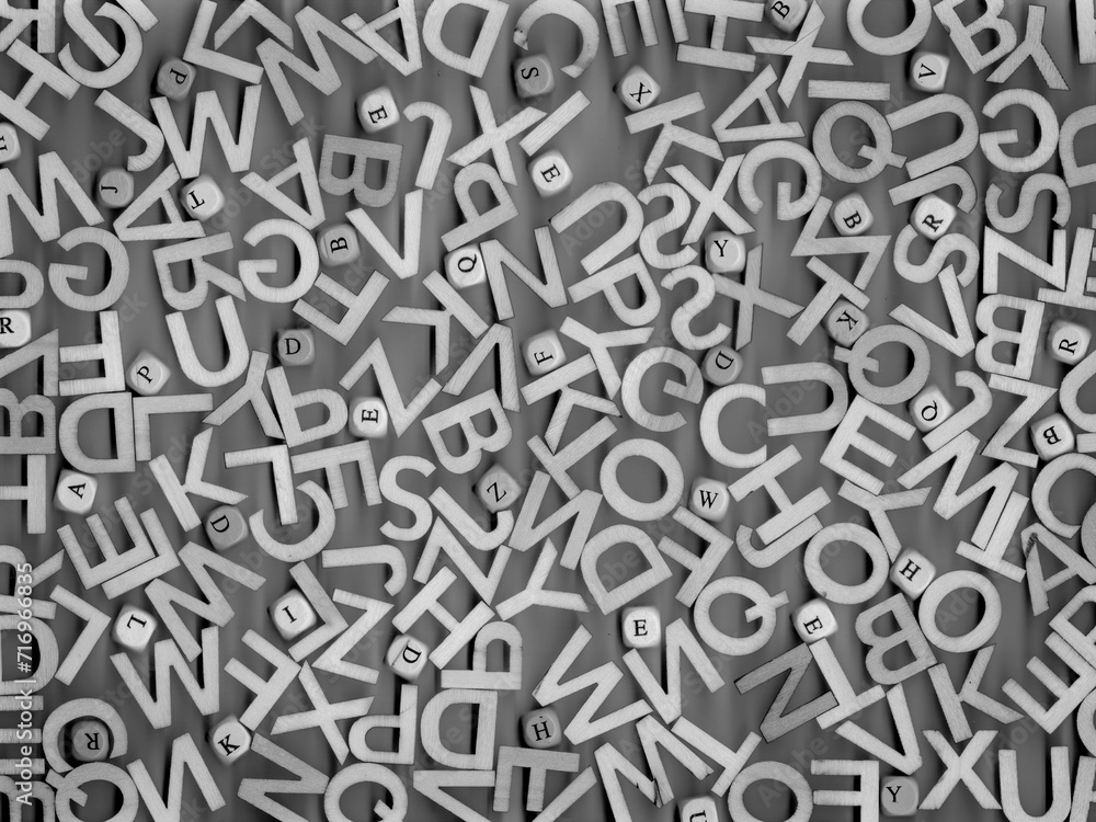 artistic arrangement of letters against a grey background creating a visual representation of alphabet soup. The letters are scattered randomly, offering a sense of disarray yet potential for creation artistic arrangement of letters against a grey background creating a visual representation of alphabet soup. The letters are scattered randomly, offering a sense of disarray yet potential for creation