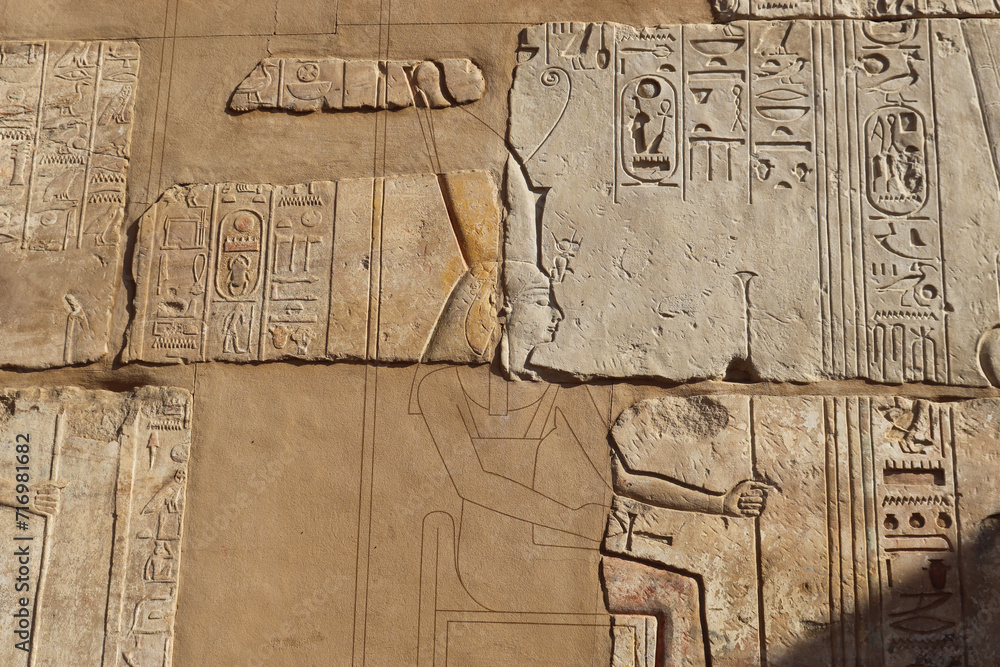 Ancient egyptian hieroglyphics carved on walls of Satet temple on Elephantine island in Aswan, Egypt Ancient egyptian hieroglyphics carved on walls of Satet temple on Elephantine island in Aswan, Egypt