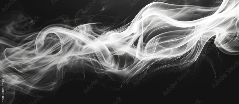 Black and white closeup of incense stick smoke in an abstract image.
