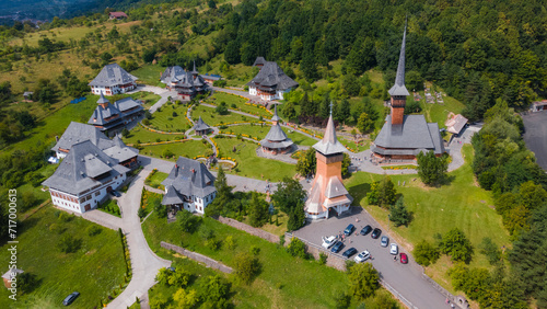 Aerial photography of Barsana monastery located in Maramures County, Romania. Photography was taken from a drone at a higher altitude with camera tilted downwards for a top view shot of the monastery. photo