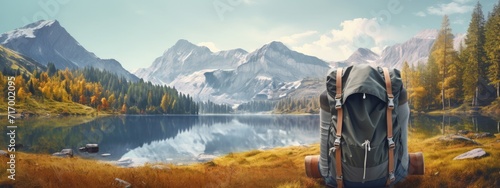 Hiking backpack and boots and equipment for mountain and forest nature. outdoor activity camping and holiday activity. lake and snow landscape banner photo