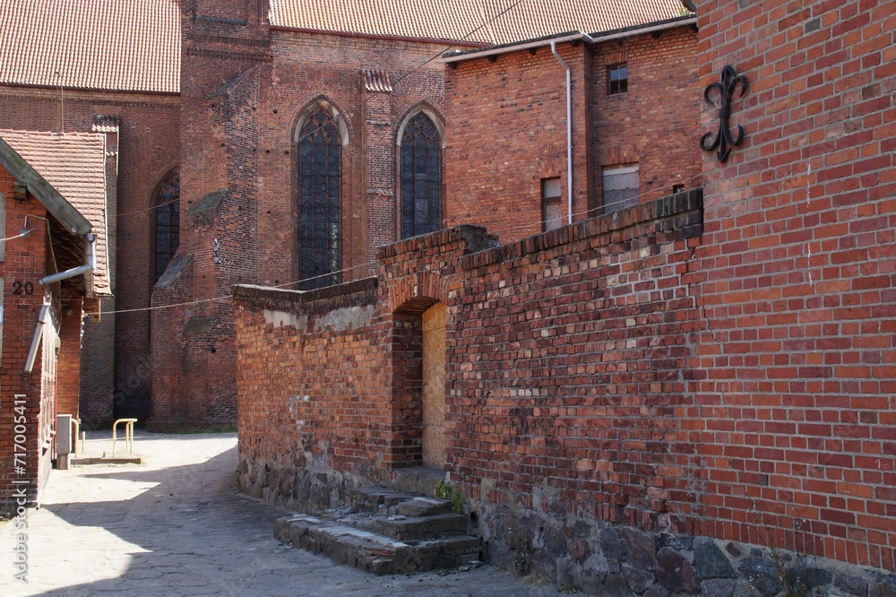 Fototapeta premium A street leading to the medieval cathedral in Chelmza, Poland.