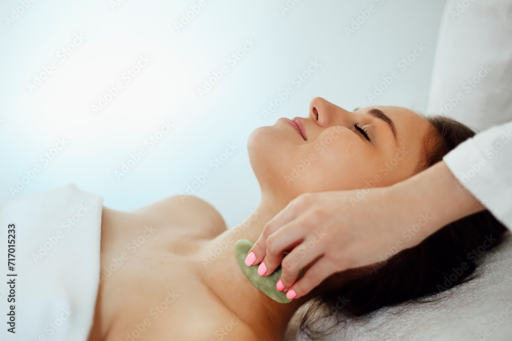 Fototapeta premium Face massage or beauty treatment in spa salon