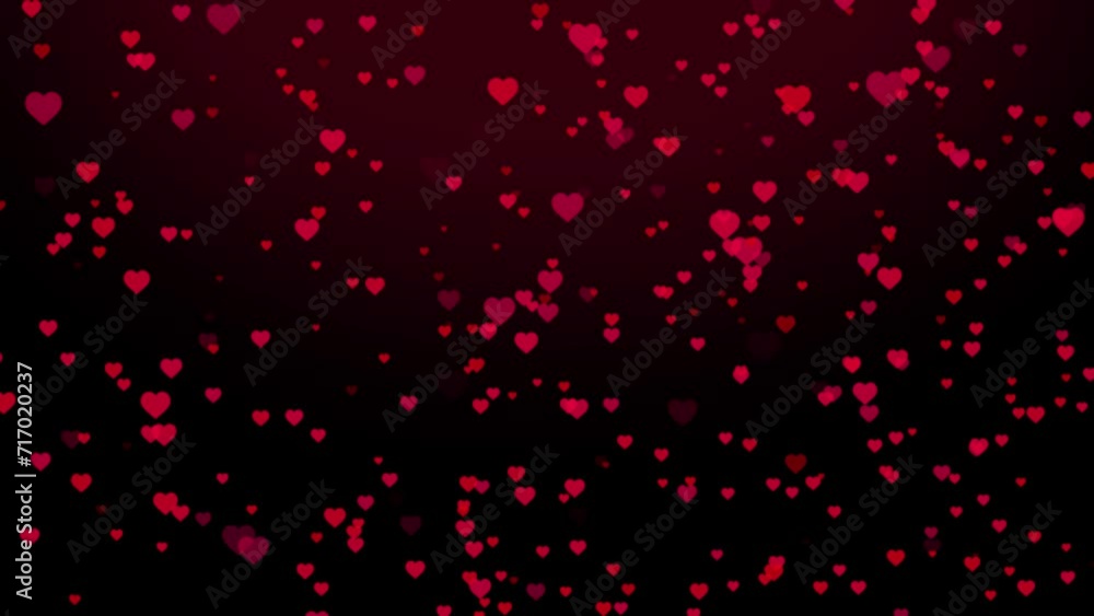 Like hearts fly from top to bottom on a black background 4k video Like hearts fly from top to bottom on a black background 4k video