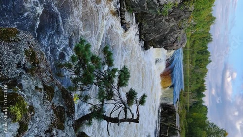 Voytsky padun waterfall in autumn. The famous powerful and wide Karelian waterfall Voytsky Padun is surrounded by rocks and greenery. Cascading waterfall on the river. Karelia, Russia 4K photo