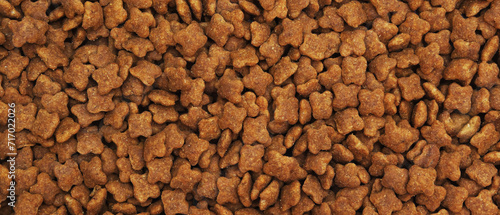 Dried food for cats or dogs in the form of a background. Panorama.