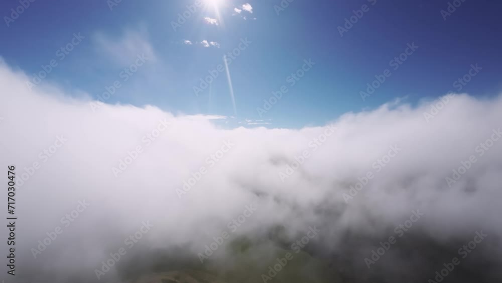 FPV freestyle flight from the first person. A fixed wing drone performs cloud surfing in low clouds. dynamic flights in the clouds
