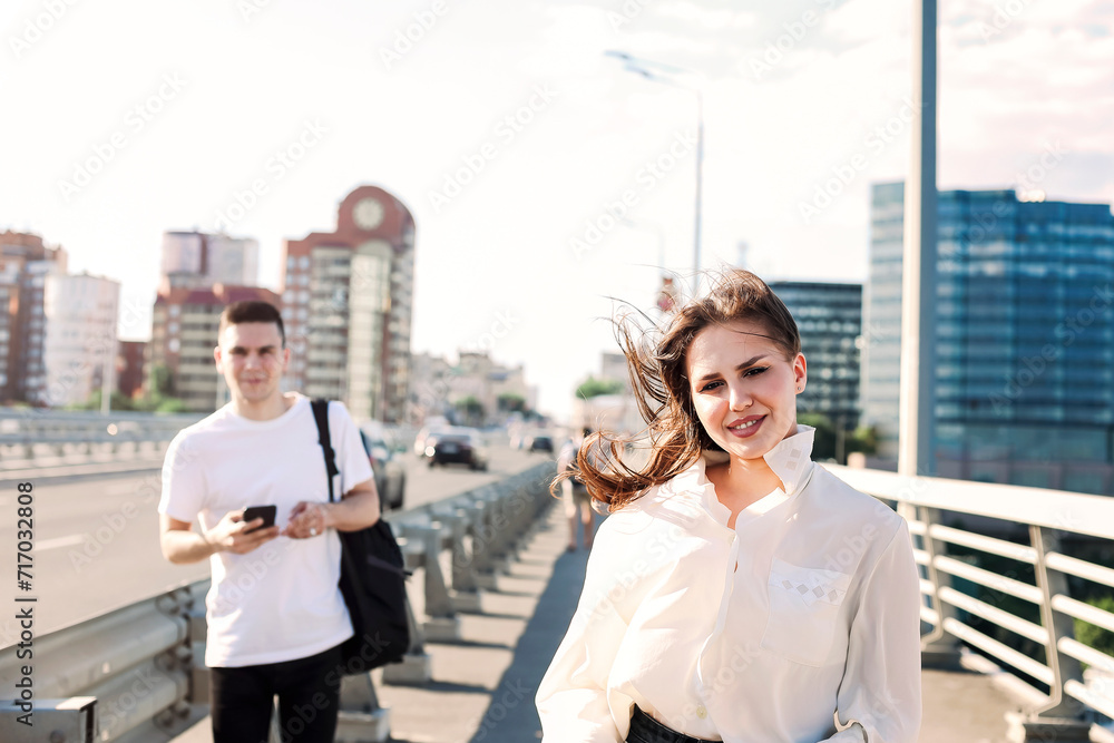 Fototapeta premium Happy couple walking along bridge
