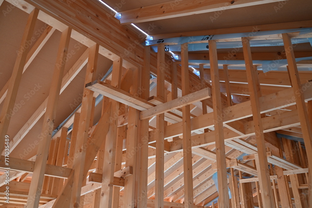 Wooden frame structure house building on a new development framing of under construction Wooden frame structure house building on a new development framing of under construction