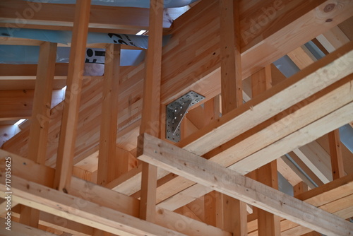 Wooden frame structure house building on a new development framing of under construction