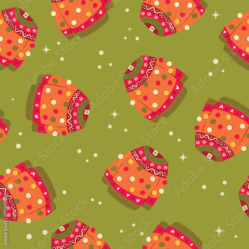 Cute vibrant hand drawn sweater with winter decoration and pom-poms seamless pattern. Colorful holiday vector illustration on green background. Vibrant repeat design.